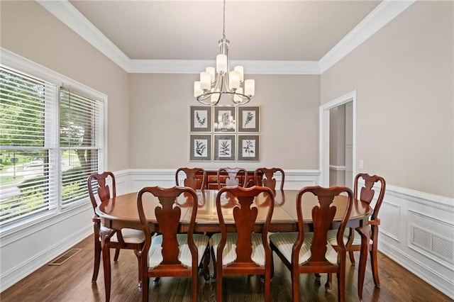 997 Thousand Oaks Bnd NW, Kennesaw, GA 30152 - dining space featuring a chandelier, healthy amount of natural light, dark wood-style flooring, crown molding, and wainscoting
