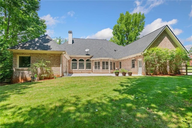 997 Thousand Oaks Bnd NW, Kennesaw, GA 30152 - rear view of house with brick siding, a chimney, and a patio area