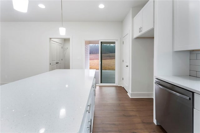 kitchen featuring white cabinetry, light stone counters, hanging light fixtures, stainless steel dishwasher, and decorative backsplash