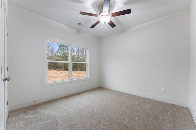 carpeted empty room featuring ceiling fan