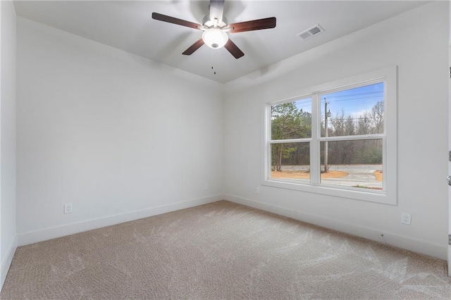 spare room featuring ceiling fan and carpet floors