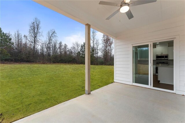 view of patio / terrace featuring ceiling fan