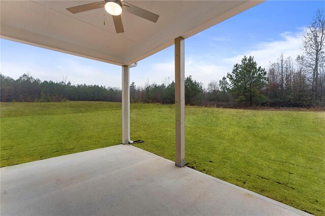 exterior space featuring ceiling fan