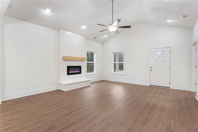 unfurnished living room featuring ceiling fan, high vaulted ceiling, dark hardwood / wood-style floors, and a fireplace