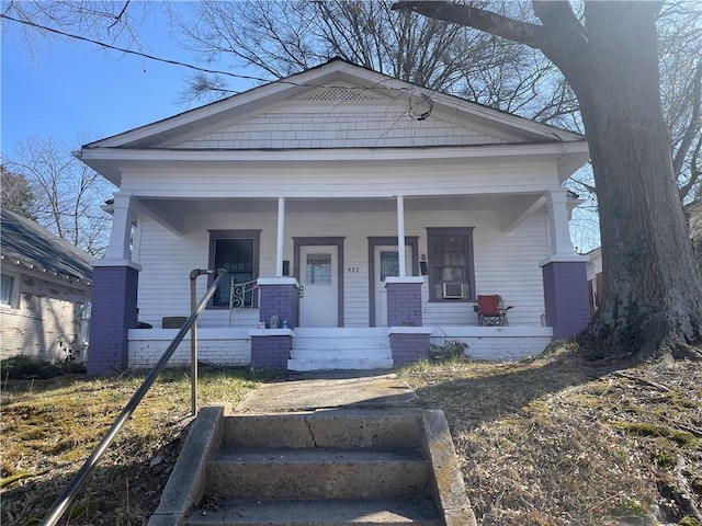 view of front of house featuring covered porch and cooling unit