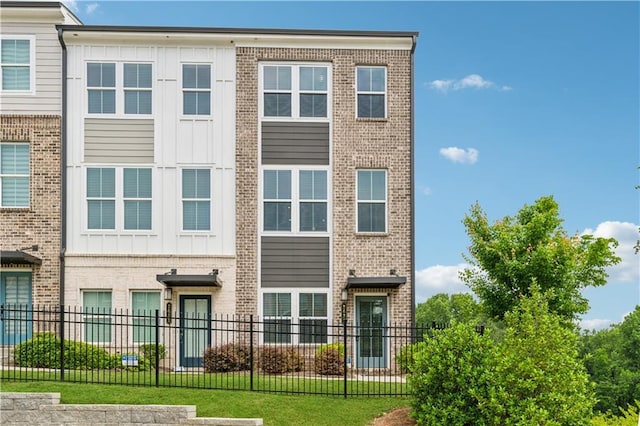 2631 Creekside Dr NW, Atlanta, GA 30318 - townhome / multi-family property with board and batten siding and brick siding