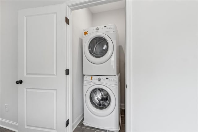 2631 Creekside Dr NW, Atlanta, GA 30318 - laundry room featuring stacked washer / dryer and baseboards