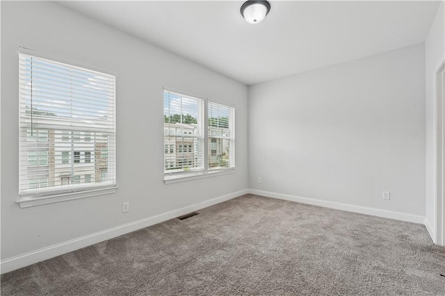 2631 Creekside Dr NW, Atlanta, GA 30318 - carpeted spare room with baseboards