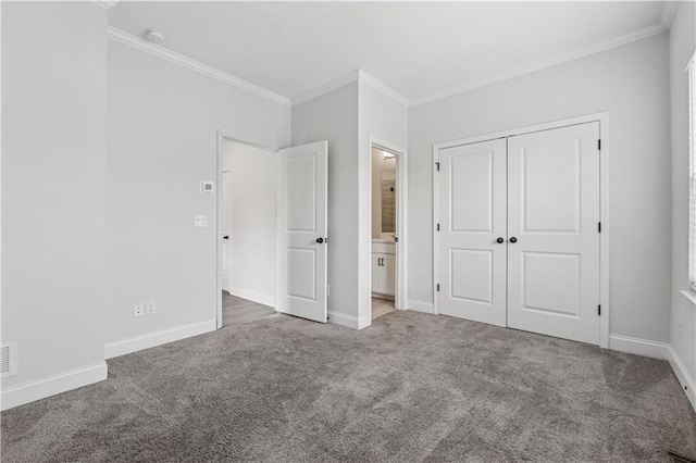 2631 Creekside Dr NW, Atlanta, GA 30318 - unfurnished bedroom with ornamental molding, carpet flooring, baseboards, a closet, and ensuite bathroom