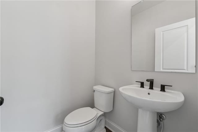 2631 Creekside Dr NW, Atlanta, GA 30318 - bathroom with baseboards and toilet