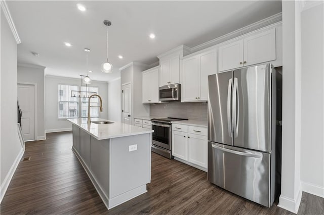 2631 Creekside Dr NW, Atlanta, GA 30318 - kitchen featuring appliances with stainless steel finishes, a sink, baseboards, white cabinets, and ornamental molding