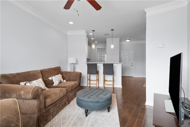 living room with dark wood finished floors, crown molding, recessed lighting, a ceiling fan, and baseboards