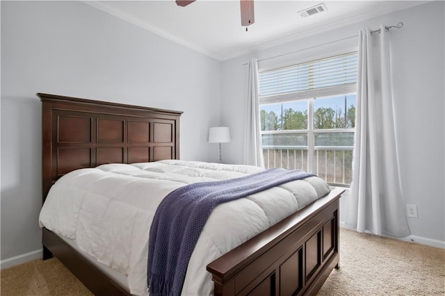 bedroom with visible vents, light carpet, baseboards, and crown molding