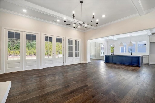 unfurnished living room with dark wood-style floors, french doors, visible vents, a chandelier, and beamed ceiling