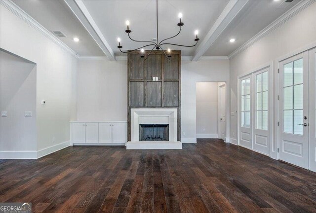 kitchen featuring light stone countertops, custom exhaust hood, crown molding, range with two ovens, and dark hardwood / wood-style floors