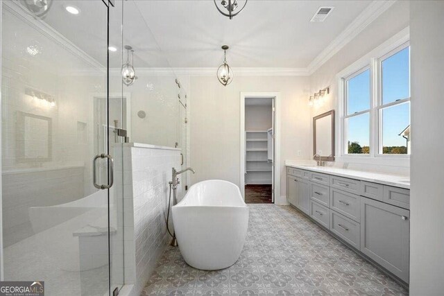 bathroom featuring vanity and a shower with door