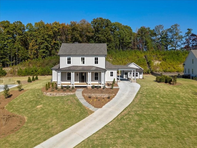 view of front of property with covered porch and a front lawn