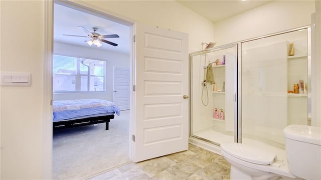 bathroom with a shower with shower door, toilet, ceiling fan, and tile floors