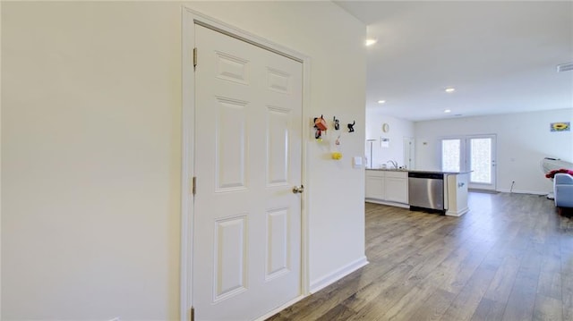 hall with hardwood / wood-style flooring