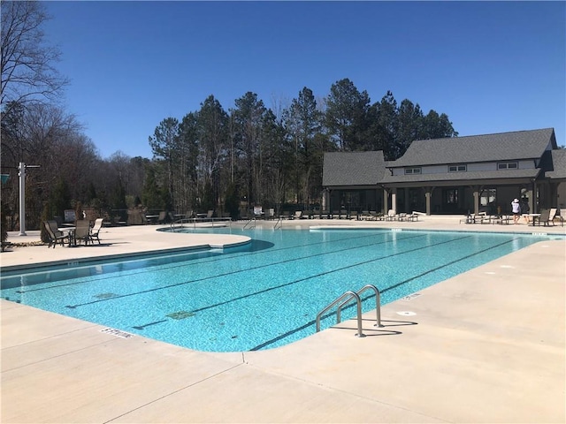 view of swimming pool with a patio area