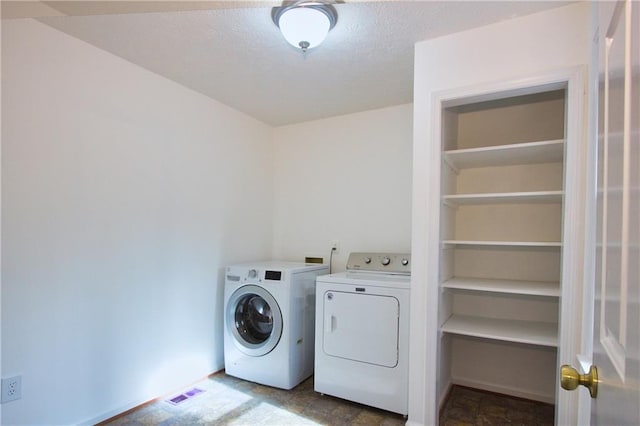 laundry room with washer and clothes dryer