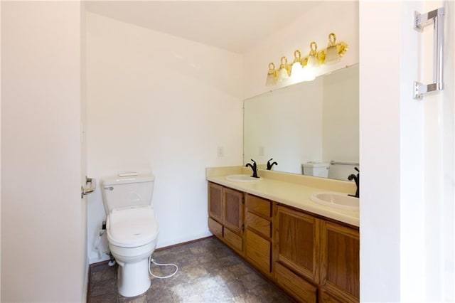 bathroom with toilet and vanity