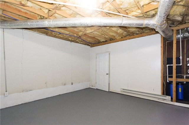 basement featuring a baseboard heating unit