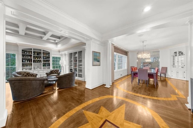 interior space with built in features, ornamental molding, beam ceiling, wood finished floors, and coffered ceiling
