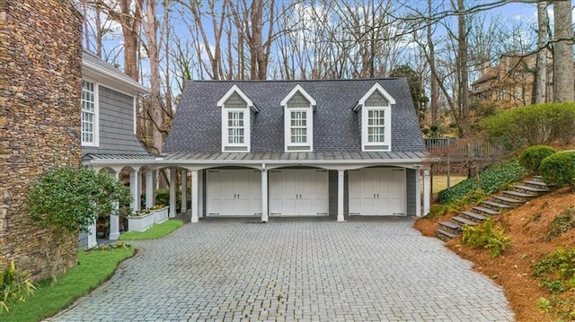 garage featuring decorative driveway