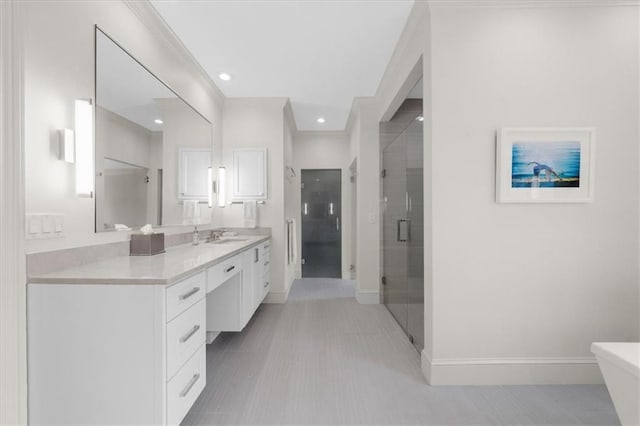 full bath with recessed lighting, a stall shower, vanity, and baseboards
