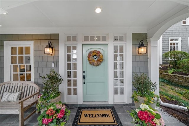 property entrance featuring a porch