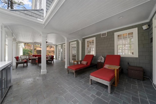 view of patio / terrace featuring an outdoor hangout area, visible vents, and ceiling fan