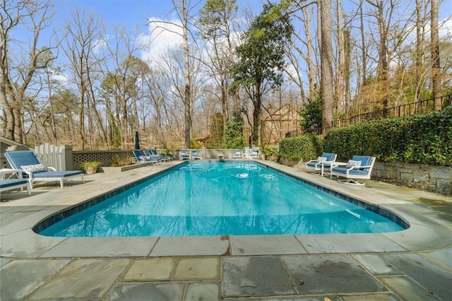 view of swimming pool with a fenced in pool, a patio area, and fence