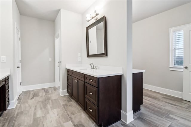 bathroom featuring vanity and hardwood / wood-style flooring