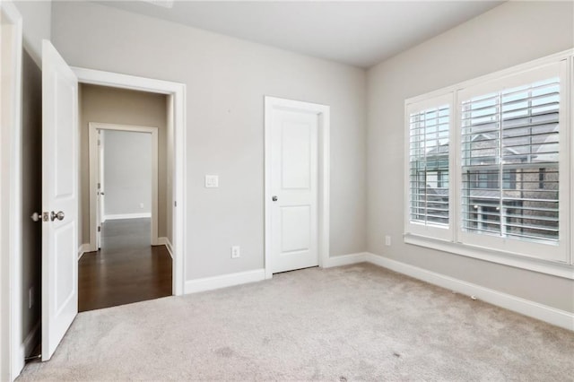 unfurnished bedroom with light carpet