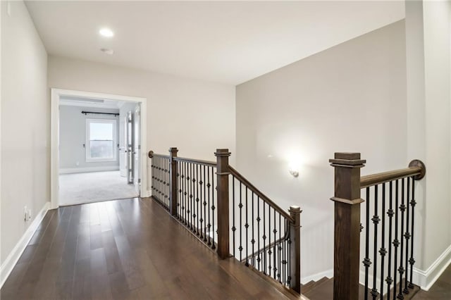 corridor featuring dark hardwood / wood-style floors