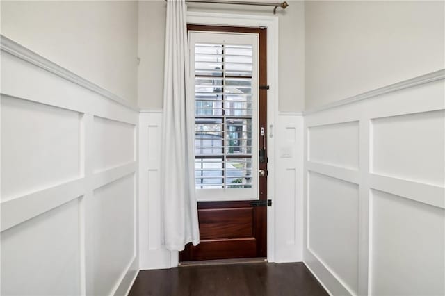 doorway featuring dark hardwood / wood-style flooring and plenty of natural light