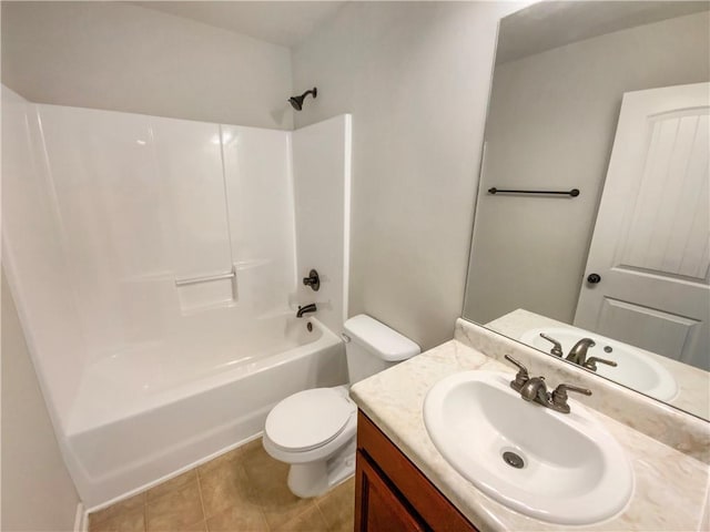 bathroom with tile patterned flooring, tub / shower combination, toilet, and vanity