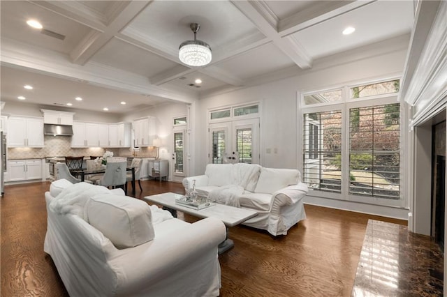 living room featuring beamed ceiling, french doors, and a wealth of natural light