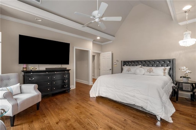 bedroom with ceiling fan with notable chandelier, high vaulted ceiling, wood finished floors, and ornamental molding