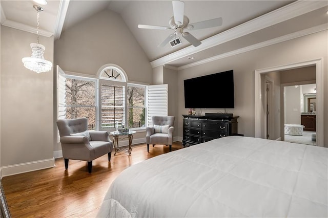 bedroom with visible vents, crown molding, baseboards, wood finished floors, and high vaulted ceiling