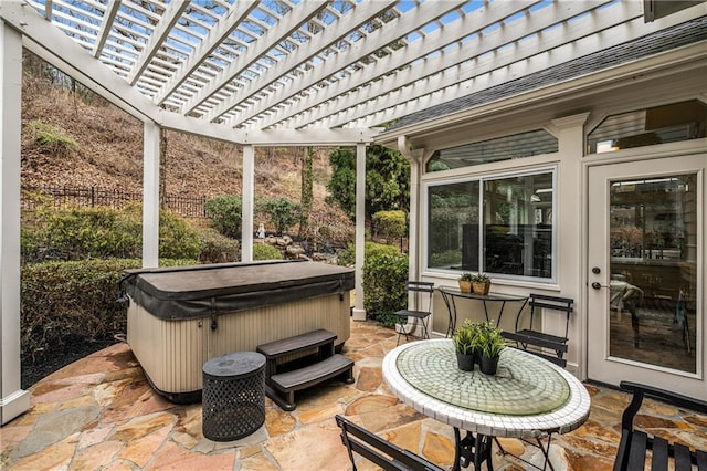 sunroom featuring a jacuzzi