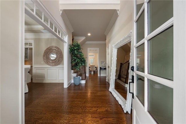 hallway with recessed lighting, stairway, wood finished floors, and ornamental molding