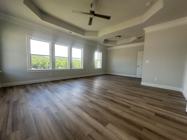 3799 Cheyenne Ln, Jefferson, GA 30549 - unfurnished room with a raised ceiling, a ceiling fan, baseboards, dark wood-type flooring, and ornamental molding