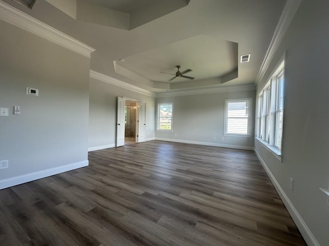 3799 Cheyenne Ln, Jefferson, GA 30549 - unfurnished room featuring a raised ceiling, ornamental molding, a ceiling fan, baseboards, and dark wood-type flooring