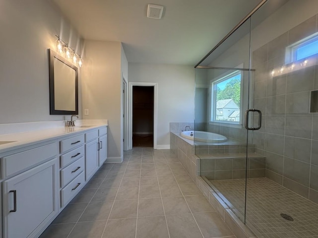 3799 Cheyenne Ln, Jefferson, GA 30549 - full bath featuring tile patterned floors, healthy amount of natural light, a shower stall, and a garden tub