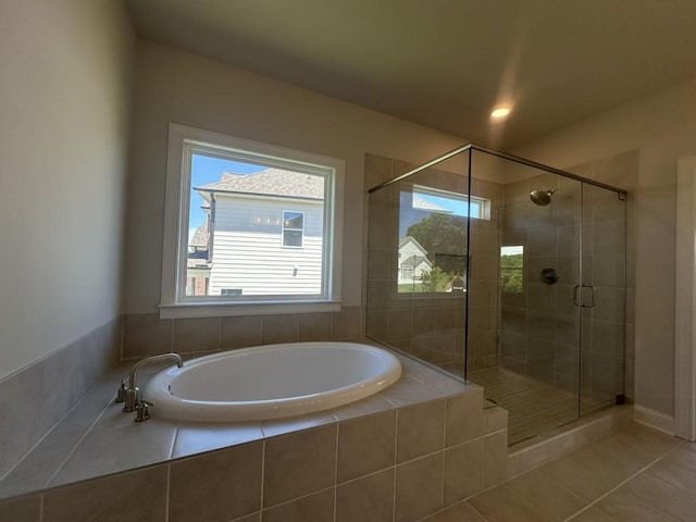 3799 Cheyenne Ln, Jefferson, GA 30549 - bathroom with a shower stall, a garden tub, and tile patterned floors