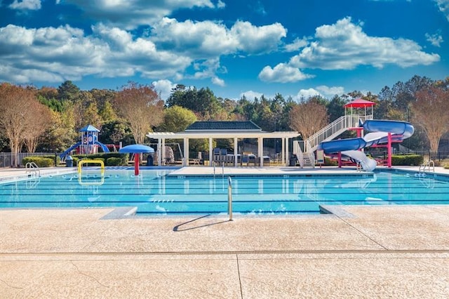 3799 Cheyenne Ln, Jefferson, GA 30549 - community pool with a water slide, a water play area, fence, and a patio area