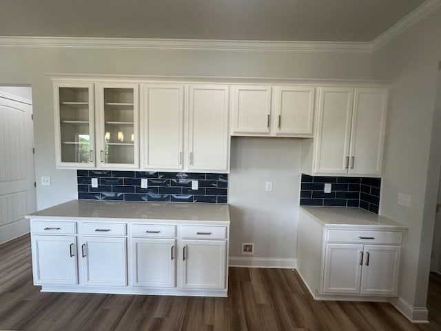 3799 Cheyenne Ln, Jefferson, GA 30549 - kitchen featuring dark wood-style floors, white cabinetry, crown molding, glass insert cabinets, and decorative backsplash