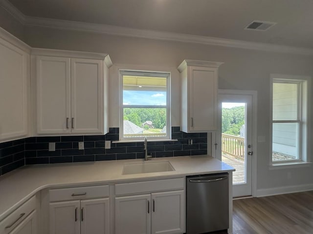 3799 Cheyenne Ln, Jefferson, GA 30549 - kitchen with dishwasher, a sink, white cabinets, ornamental molding, and tasteful backsplash